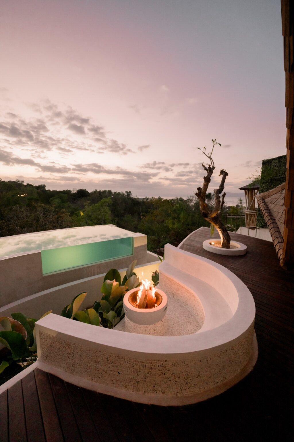 Fire ritual beside the private pool at sunset